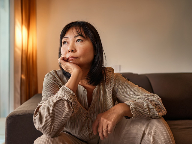A seated woman who needs to talk to someone